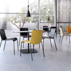 Liz Chair by Walter Knoll. It gently spans its expanses of fabric or leather for seat and back. The delicate framework gives stability to an elastic textile inside.